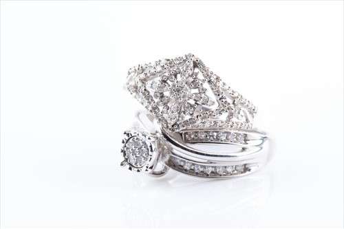 Lot 388 - A white metal and diamond accent crossover...