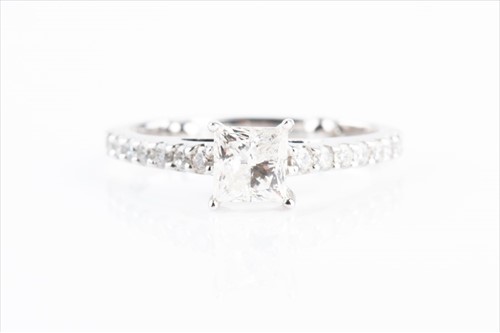 Lot 619 - A diamond engagement ring set with a...