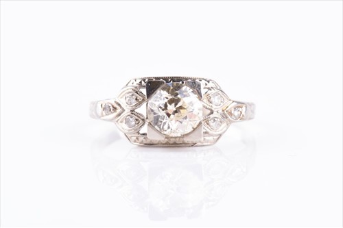 Lot 385 - A white metal and diamond ring in the early...