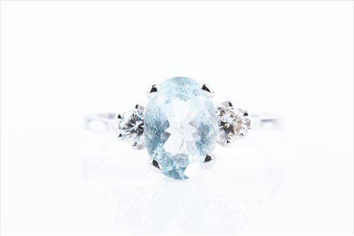 Lot 603 - A 9ct white gold, diamond, and aquamarine ring...