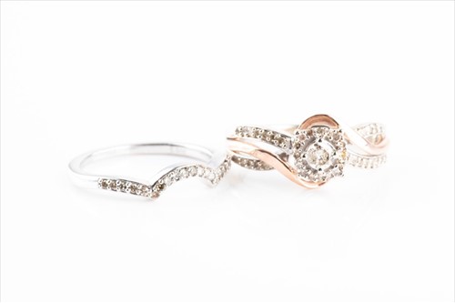 Lot 436 - A 9ct rose and white gold and diamond ring set...