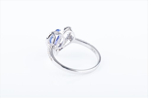 Lot 460 - A white sapphire and tanzanite heart-shaped...