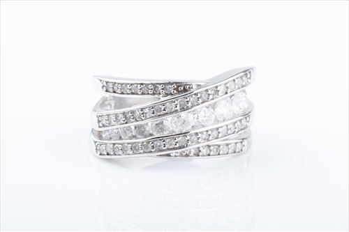 Lot 461 - An unusual diamond crossover ring channel-set...