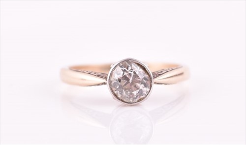 Lot 550 - A 14ct yellow gold and solitaire diamond ring...