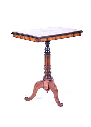 Lot 18 - A Victorian walnut inlaid tripod table the top...