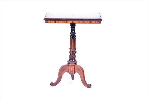 Lot 18 - A Victorian walnut inlaid tripod table the top...