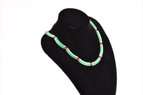Lot 706 - A 14ct yellow gold and green jade necklace set...