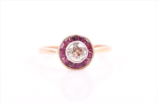 Lot 499 - An 18ct yellow gold, diamond, and ruby target...