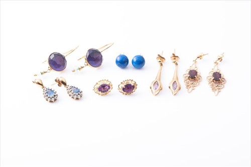 Lot 590 - A pair of yellow metal and amethyst drop...