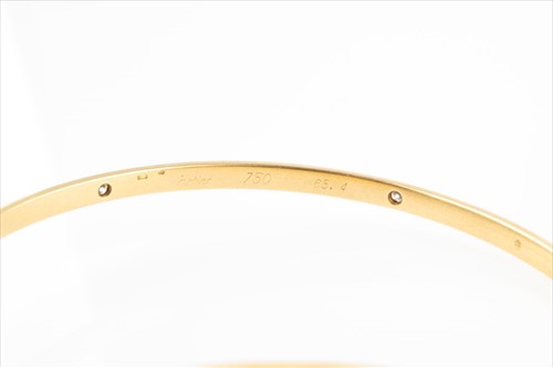 Lot 362 - Cartier. An 18ct yellow gold and diamond...