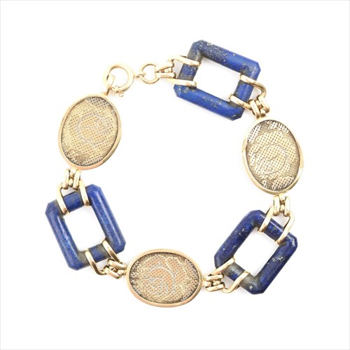 Lot 498 - An unusual yellow metal and lapis...