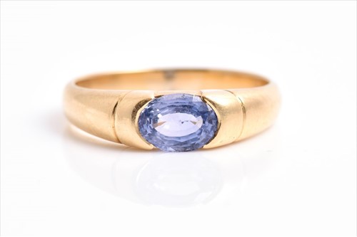 Lot 491 - An 18ct yellow gold and tanzanite ring set...