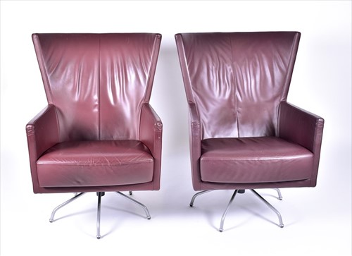 Lot 28 - A pair of mid century design leather swivel...