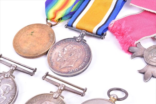 Lot 267 - A group of militaria and medals comprising a...