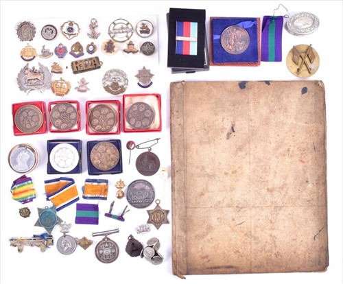 Lot 268 - A group of militaria and medallions comprising...