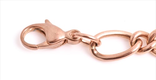Lot 668 - A 9ct rose gold flattened figaro link chain...
