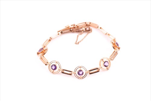 Lot 671 - A 15ct yellow gold and amethystÂ bracelet set...