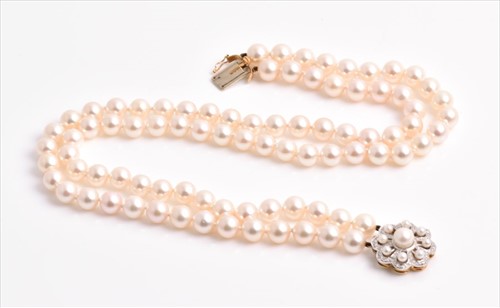 Lot 685 - A double strand pearl necklace of rounded...