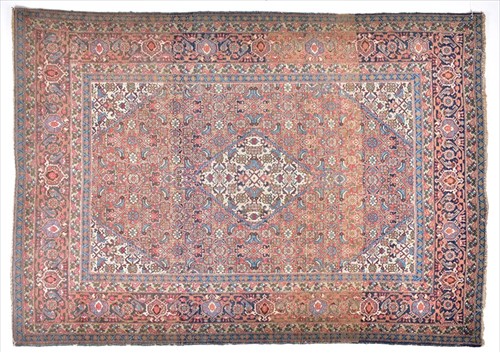 Lot 66 - An Eastern Tabriz rug designed with a central...