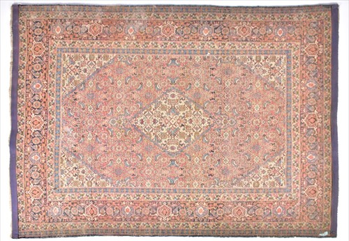 Lot 66 - An Eastern Tabriz rug designed with a central...