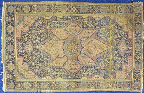 Lot 67 - A Persian Heriz rug designed with central...