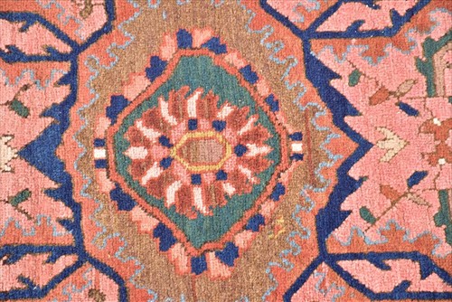 Lot 67 - A Persian Heriz rug designed with central...