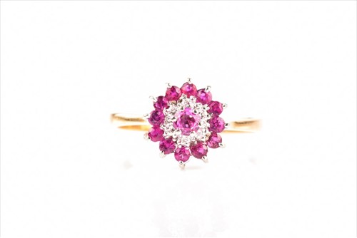 Lot 556 - A yellow metal, diamond, and pink sapphire...