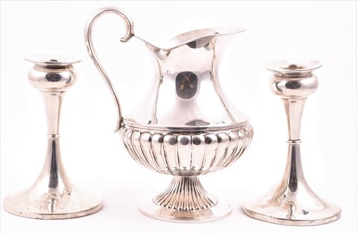 Lot 434 - A pair of George V silver candlesticks...