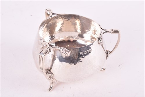 Lot 437 - A Edwardian Arts & Crafts style silver tea set...