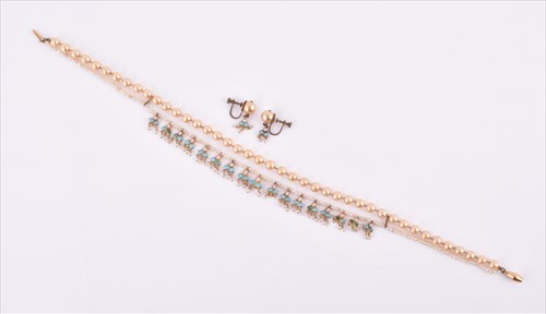 Lot 543 - An unusual yellow metal, pearl, and turquoise...