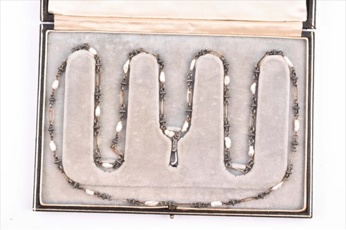 Lot 597 - An Arts & Crafts necklace the tooled white...