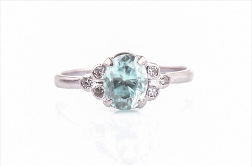 Lot 447 - A blue zircon and white stone ring centred...