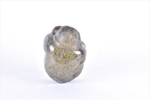 Lot 207 - A hardstone Inuit carving of a mother and...