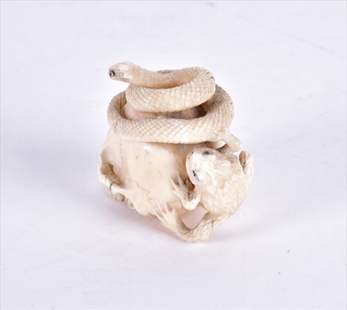 Lot 139 - A Japanese Meiji period ivory netsuke carved...