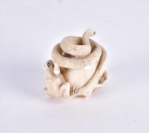 Lot 139 - A Japanese Meiji period ivory netsuke carved...
