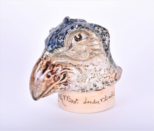 Lot 238 - A Martin Brothers stoneware bird jar cover...