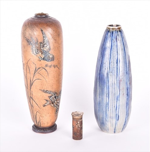 Lot 214 - A Martin Brothers tall earthenware bottle vase...