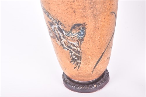 Lot 214 - A Martin Brothers tall earthenware bottle vase...