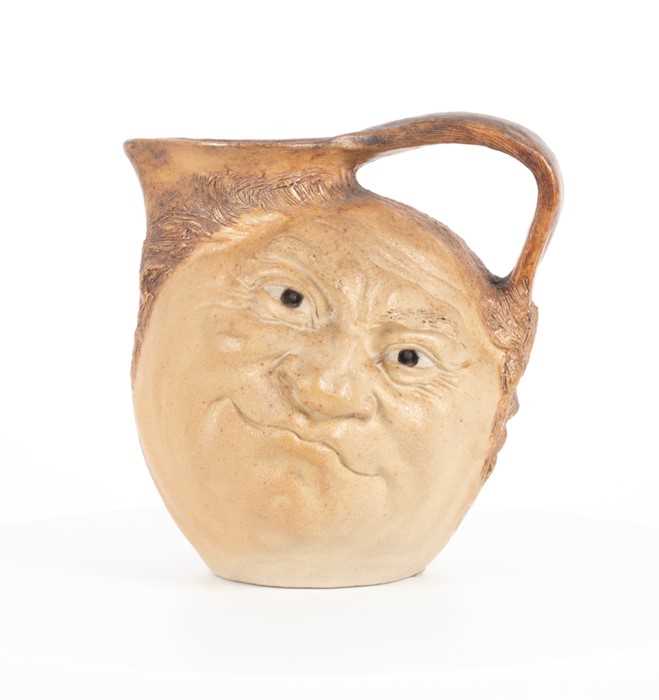 Lot 224 - A Martin Brothers double-sided stoneware face...