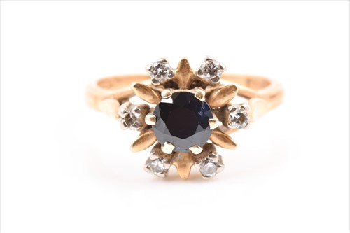 Lot 571 - An 18ct yellow gold, diamond, and sapphire...