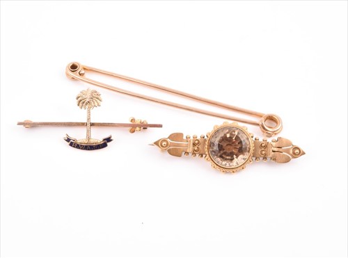 Lot 567 - A 15ct yellow gold and citrine bar brooch...