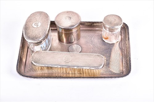 Lot 470 - An early 20th silver five-piece dressing table...