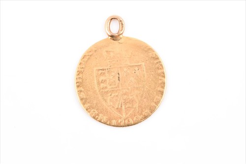 Lot 555 - A George III spade guinea coin pendant with...