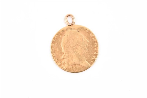 Lot 555 - A George III spade guinea coin pendant with...