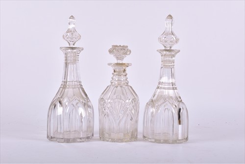 Lot 265 - A near pair of Victorian cut glass decanters...