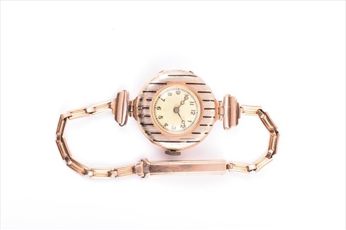 Lot 510 - A ladies yellow metal and enamel wristwatch...