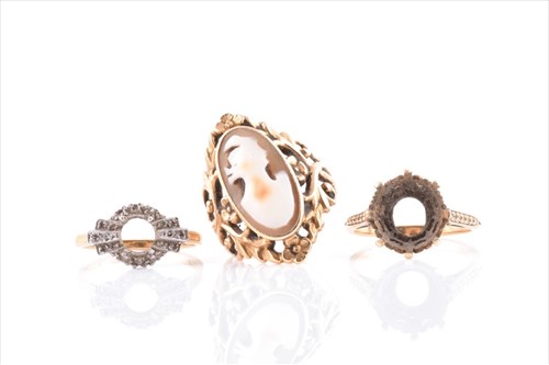 Lot 515 - A yellow metal and cameo ring the openwork...