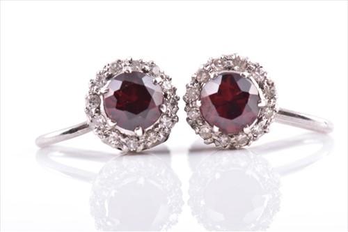 Lot 689 - A pair of 18ct white gold, diamond, and garnet...