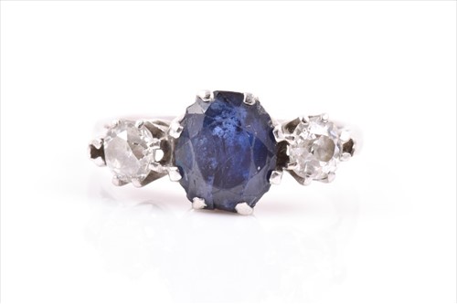 Lot 687 - A platinum, diamond, and sapphire ring set...