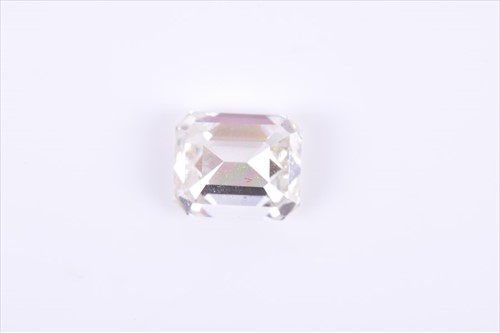 Lot 603 - A loose emerald-cut diamond of approximately 0....